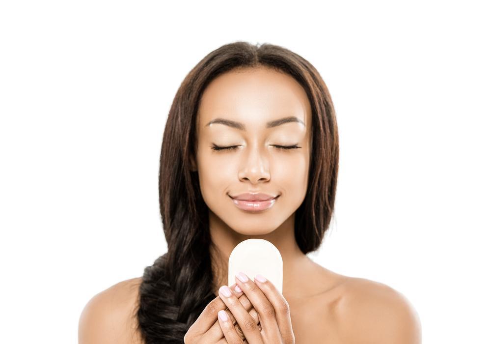 woman cleansing face to get rid of dead skin