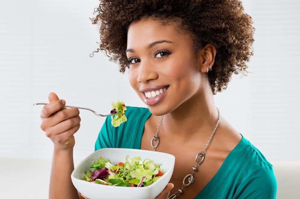 woman eating foods from an anti-aging diet