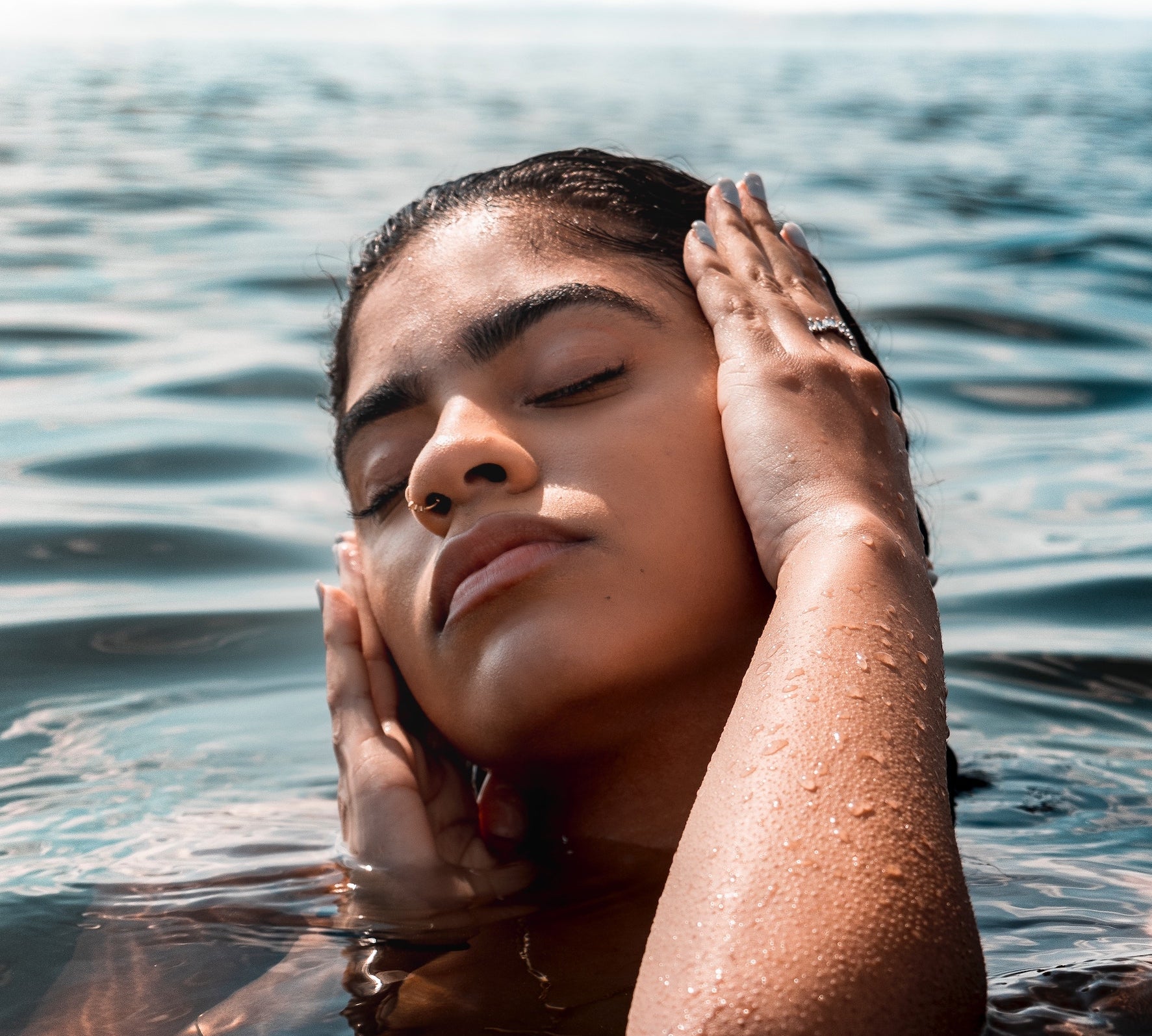 woman with hands on face