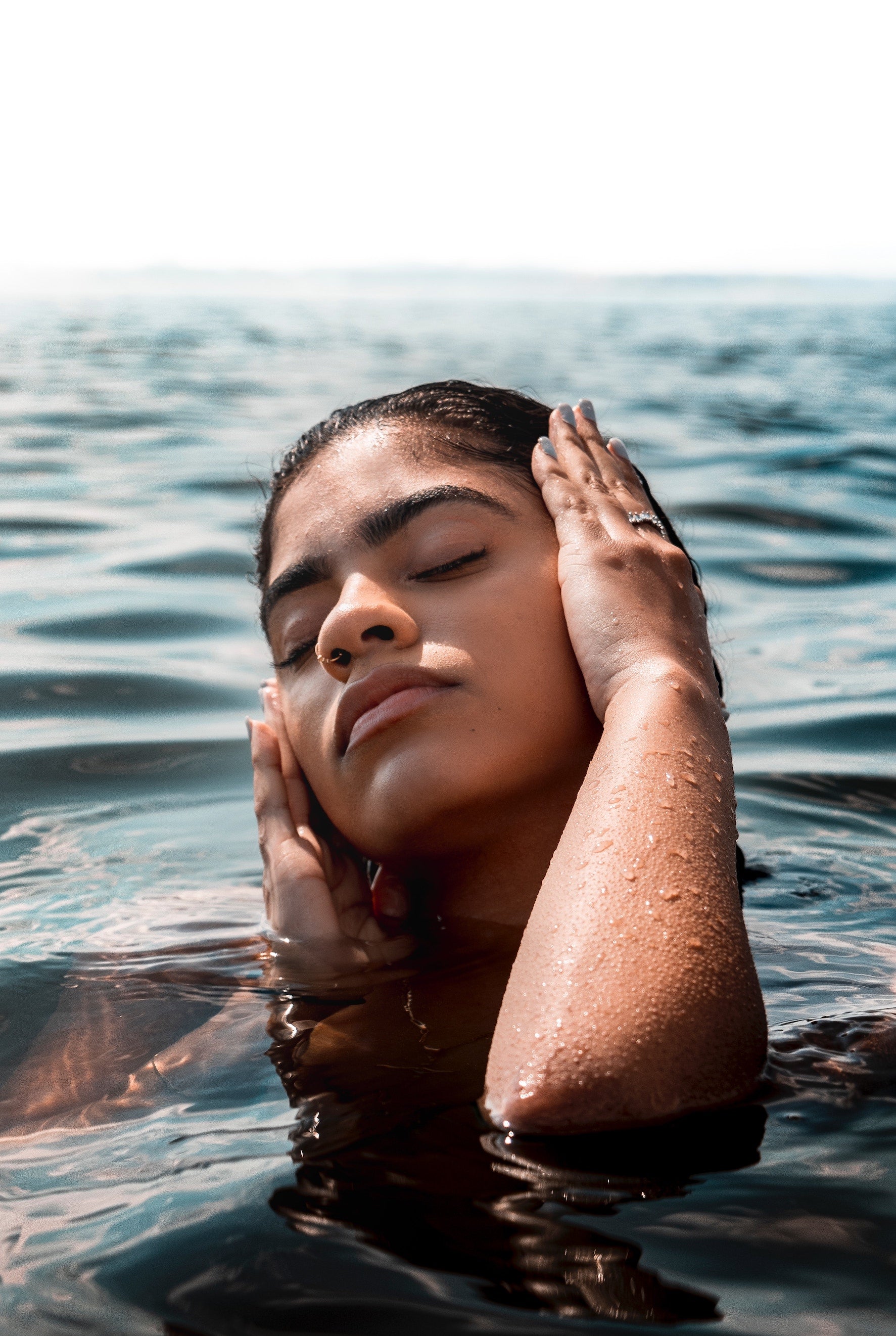 woman with hands on face